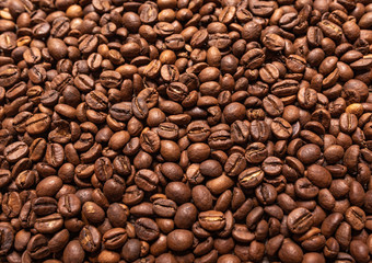 Black coffee beans closeup as a background.