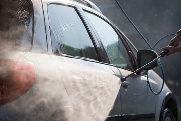 Manual car washing with high pressured water