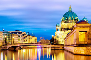 Berlin cathedral Berliner Dom in the evening twilight sunset with Spree river and reflections. Berlin, Germany.