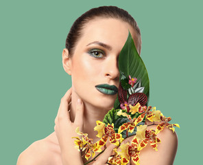 Beautiful young woman with bright makeup on white background