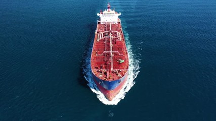 Aerial drone video of industrial crude oil  tanker cruising deep blue Mediterranean sea