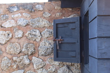 old wooden door in brick wall