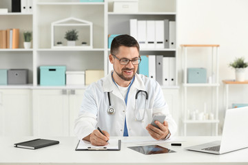 Male doctor working in clinic