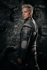 Ready for new discovery. Portrait of concentrated young cosmonaut with caucasian face wearing...