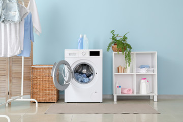 Interior of home laundry room with modern washing machine