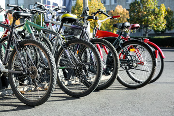 Fototapeta na wymiar Many modern bicycles parked outdoors