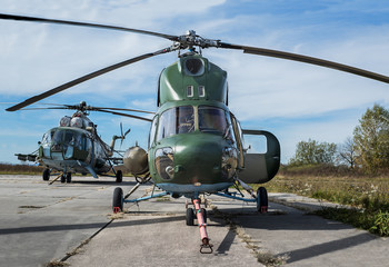 Naklejka na ściany i meble helicopters Ukrainian army aviation at the field airfield