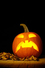 Scared Jack O Lantern halloween pumpkin with candlelight inside