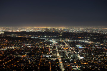 Night mountaintop view of downtown Glendale with Los Angeles California towers in background.  