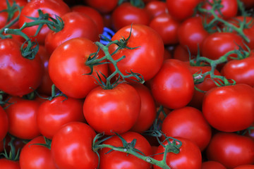 Background of ripe tomatoes on the market