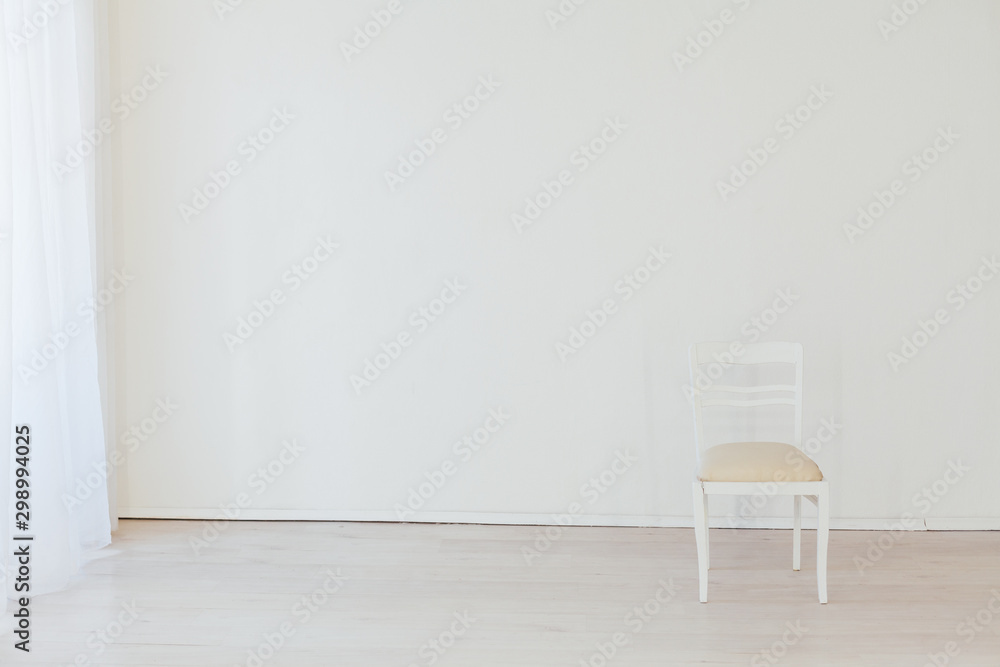 Wall mural one old vintage chair in an empty white room