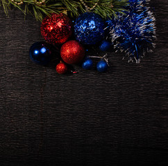 Background black for Christmas card with Christmas tree toys and shiny tinsel