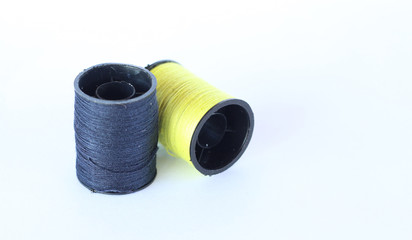 sewing thread over white background