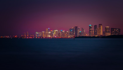 miami night buildings colors lights water view reflection