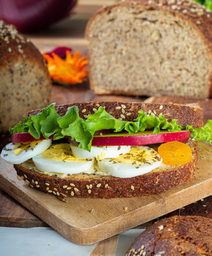 Multi Grain Sandwich With Eggs, Onions, Tomato And Lettuce 