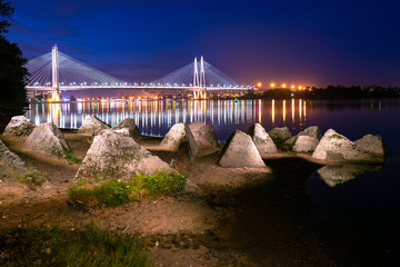 Panorama of the evening city. Bridges Of St. Petersburg. Rivers Of St. Petersburg. Night view of St. Petersburg from the Bank of the Neva. Obukhovskiy bridge. Cable-stayed bridge is beautifully lit.