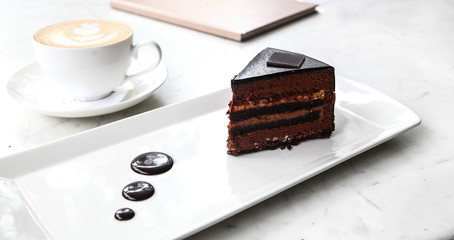 cup of coffee and chocolate cake