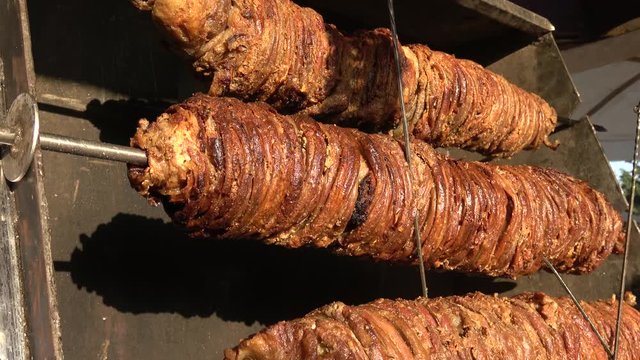 Nif village, Mugla, Turkey - 71th of July 2019: 4K Nif festival - Close up Kokoretsi roasting in charcoal burner