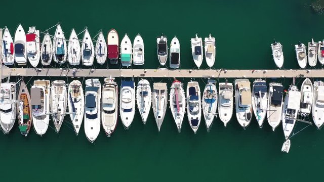 Top view of boats in Procida, Italy, the most popular tourist attractions on the beach. Action. Yacht parking, yacht and sailboat is moored at the quay