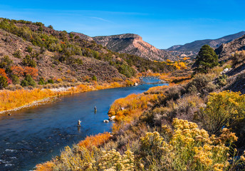 Beautiful autumn colors with fly fishermen on Rio Grande river flowing through New Mexico	 - 299000057