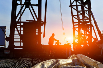 Oil field oil workers at work