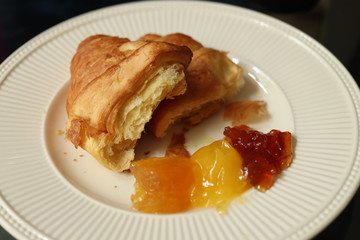 Fresh croissant, lemon curd and marmelade
