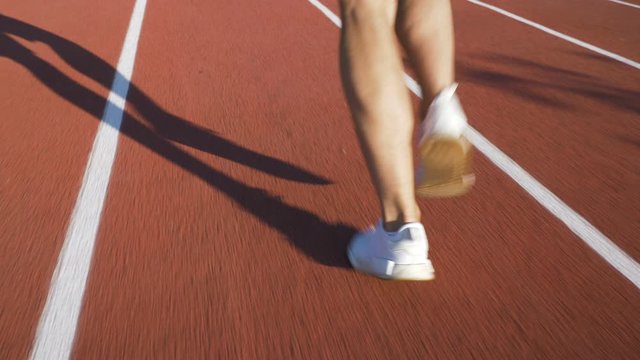 Athlete running on the track for running at sunrise.