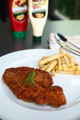 grilled steak with fries and french fries