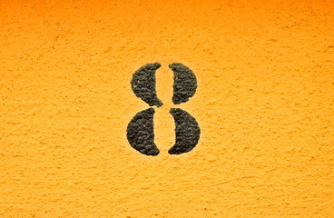 8, number eight, black digits on graduated orange / saturated yellow background.
