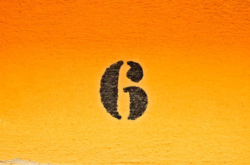 6, number six, black digits on graduated orange / saturated yellow background.