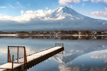 Fuji Mountain Reflection and Boat Pier covered with Snow in Winter Cloudy Day at Kawaguchiko Lake, Japan