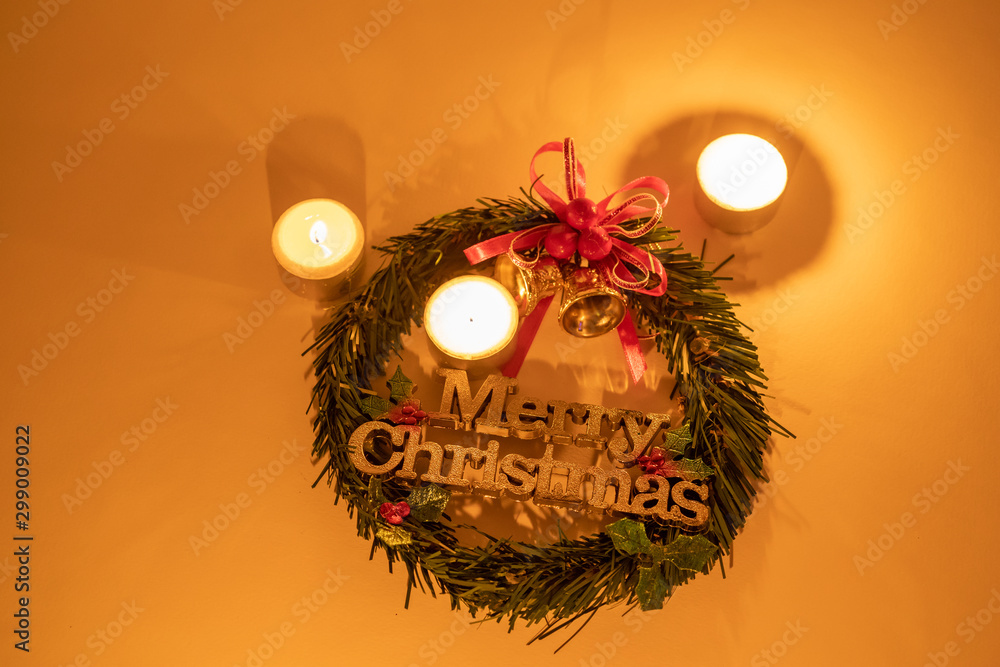 Wall mural Christmas wreath with candle lighting