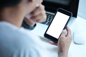 Cropped shot view of man hands holding smart phone with blank copy space screen for your text message or information content, female reading text message on cell telephone during in urban setting. 