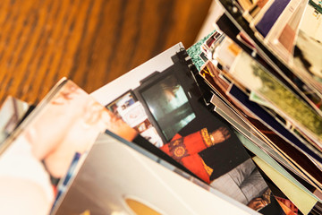 Stack of old photo prints and Memories to be digitized a