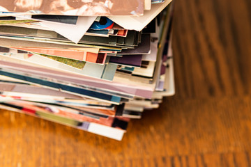 Stack of old photo prints and Memories to be digitized 