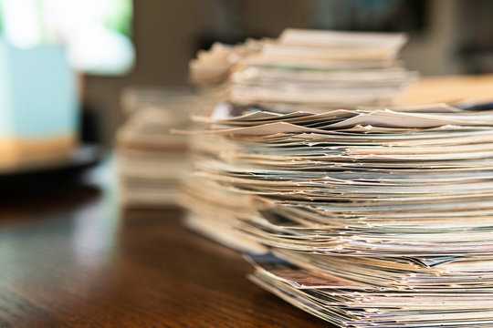 Stack of old photo prints and Memories to be digitized a