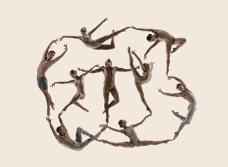 The group of modern ballet dancers. Contemporary art ballet. Young flexible people in tights. Copyspace. Concept of dance grace, inspiration, creativity. Made of shots of 9 models.