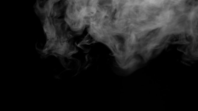 The smoke motion isolated on black background ,slow motion movement