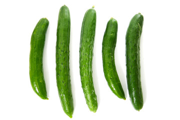 green long cucumbers on a white background