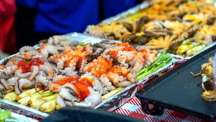 Grilled squid with chutney, satay, spices. Vietnamese street food