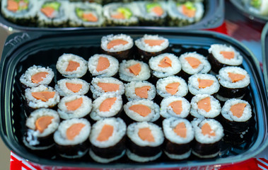 Sushi roll with fish, shrimps, eggs or vegetables is a popular Japanese food