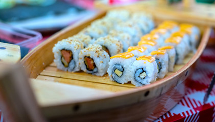 Sushi roll with fish, shrimps, eggs or vegetables is a popular Japanese food