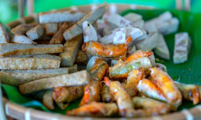 Vietnamese Fresh spring rolls with shrimp, meat, eggs, fish cakes, vegetables, sauces, Vietnamese street food