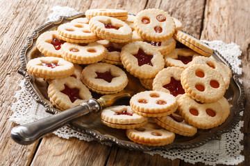 Linzer cookies with jam on a plate. Traditional Austrian biscuits filled. horizontal