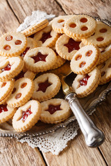 Assortement of christmas cookies vanilla kipferl, linzer cookie close-up. Vertical