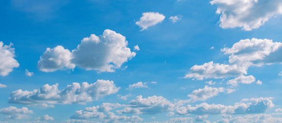 white cloud on blue sky background with sunshine