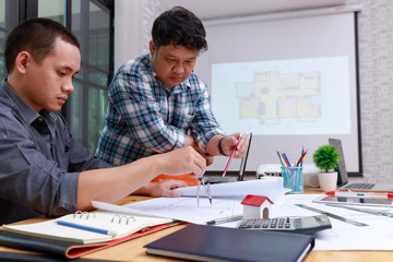 Engineer and Architect concept, Engineer Architects  and Interior designer office team working with blueprints