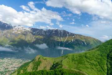 Naklejka na ściany i meble Panoramic beautiful view of the Stepantsminda village in the mountains
