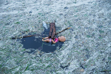 Doll Floating In Water