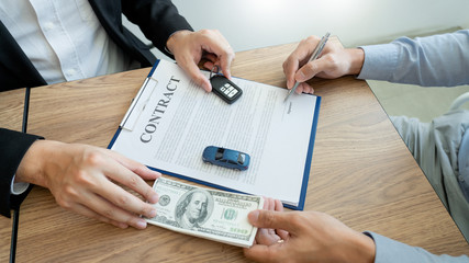 agent broker man holding document showing an transportation contract form to client ownership  customer and salesman with car key.
